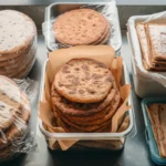 Homemade flatbread stored in containers for freshness.